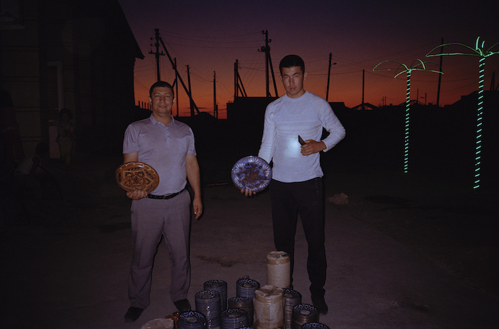 Photos by Olga Shurygina. Residents of Muynak with plates they collected for the project, 2019