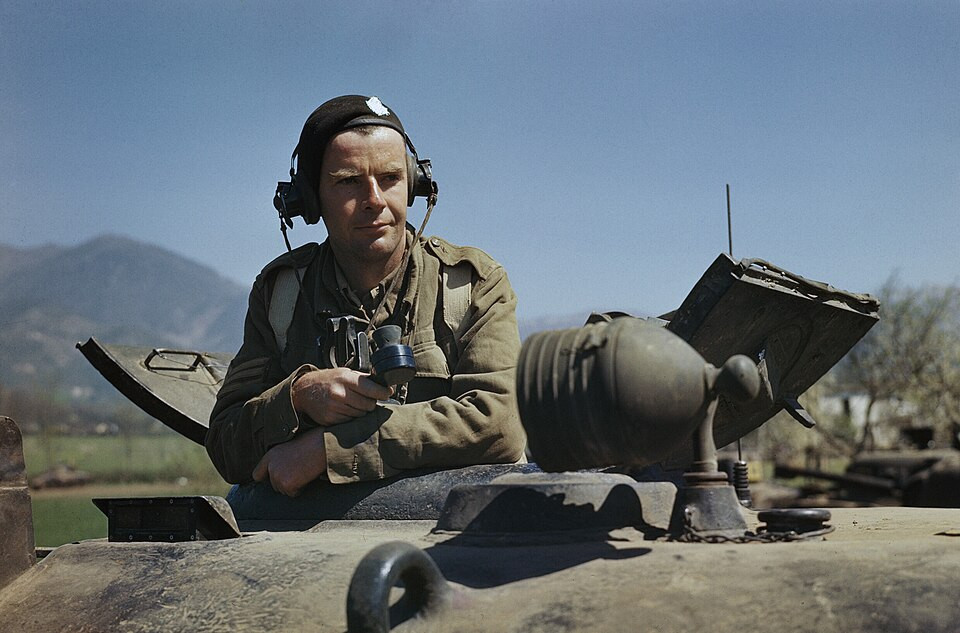 Sergeant A G Williams of the 17th-21st Lancers in the turret of his Sherman tank at San Angelo in Italy, April 1944