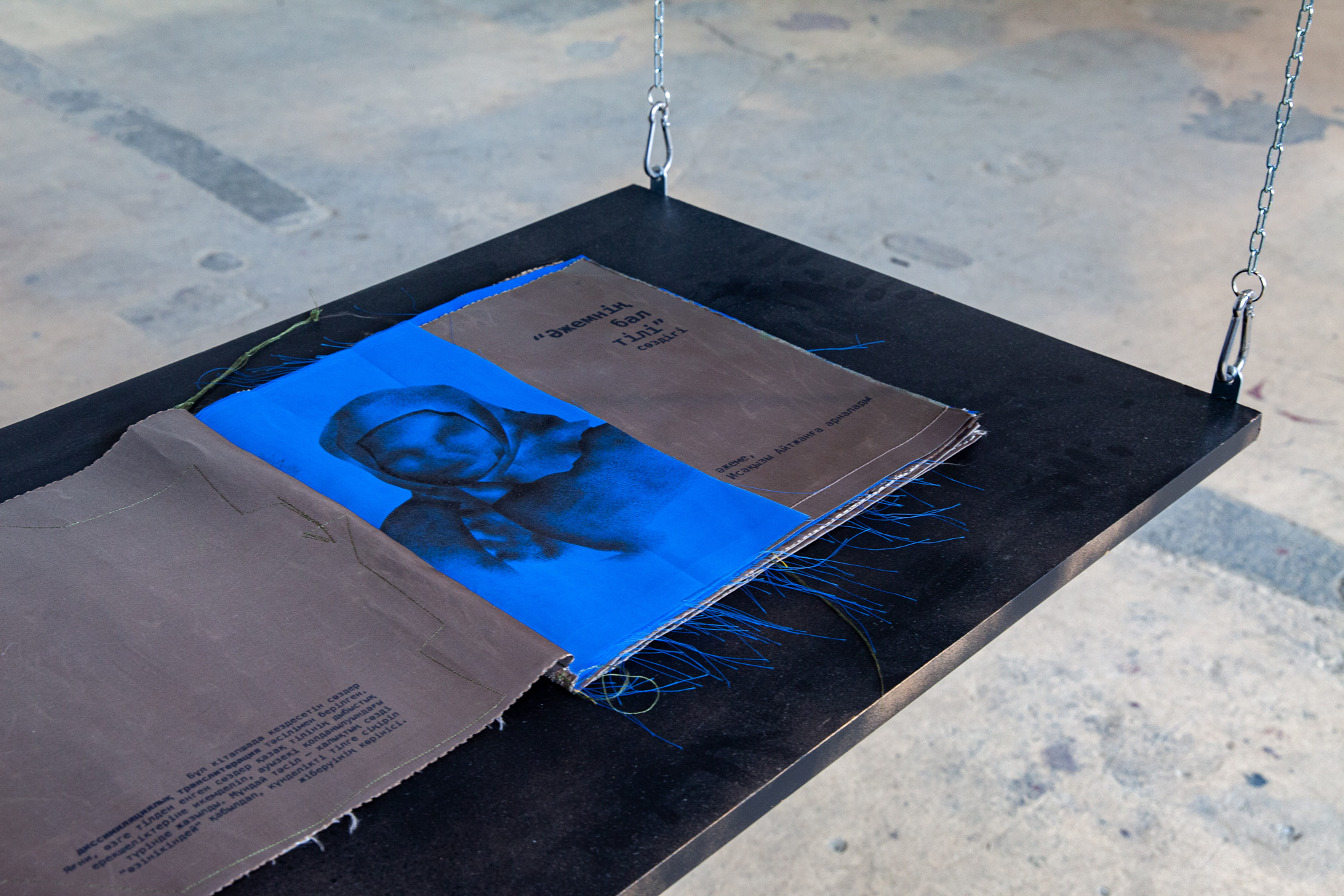 Textile book Әжемнің бал тілі [azhemnin bal tili] (My grandmother’s honeyed words) by Nazira Saduaqas in TAKE aSEAT. MAKE aSHIFT exhibition, Kulturfabrik Moabit, Berlin, 2025