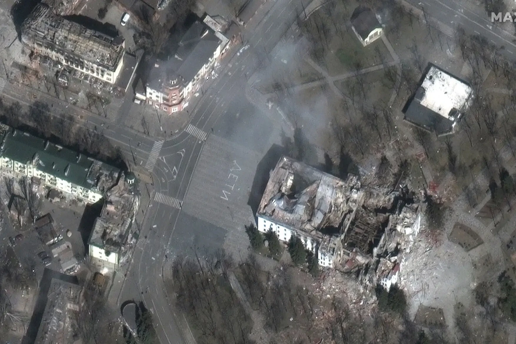 Fig.1 “Children”: The bombed-out Donetsk Academic Regional Drama Theatre in Mariupol, Ukraine. Maxar satellite image released on March 16, 2022 | NBC News