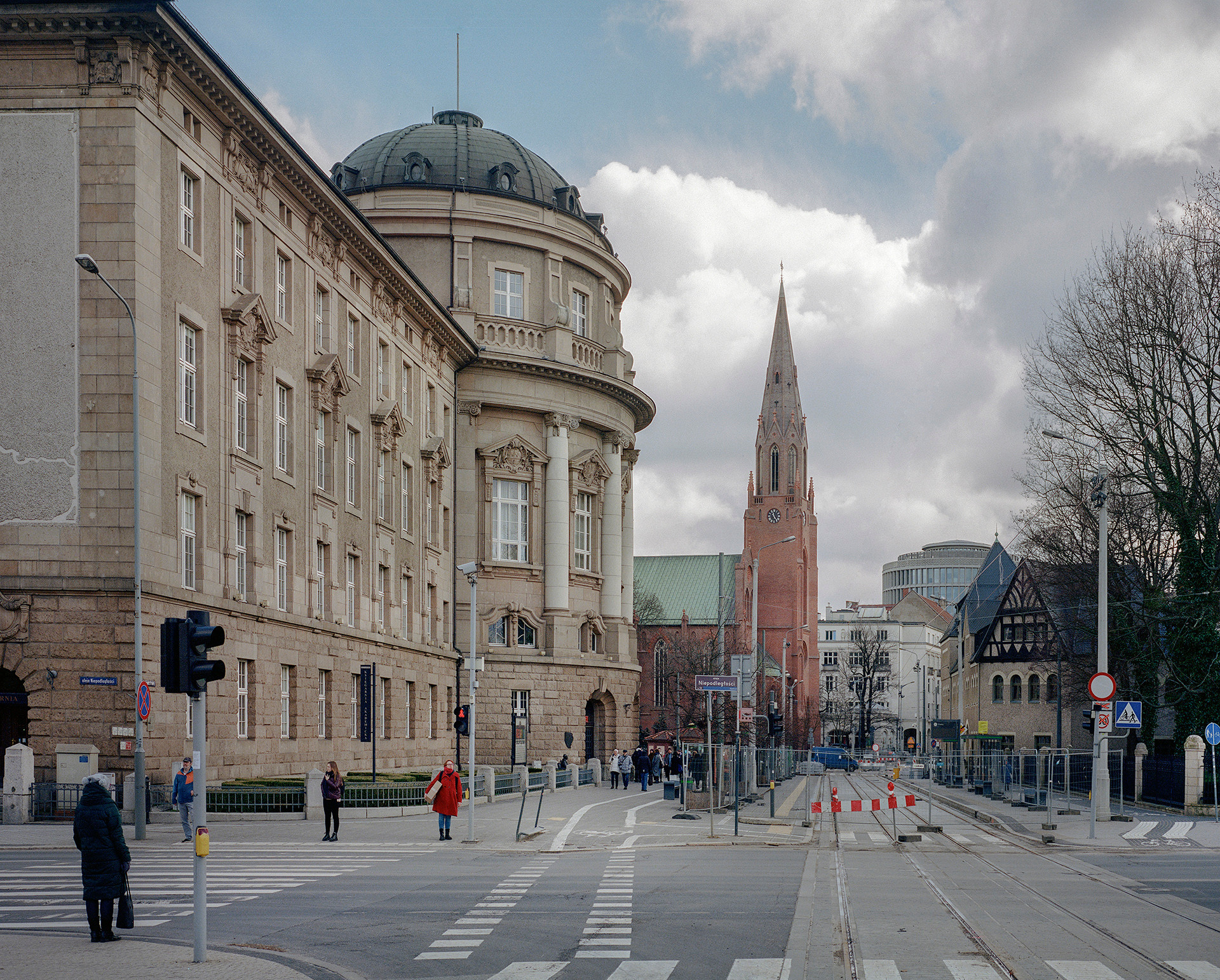 From left to right: former Royal Prussian Settlement Commission, today Collegium Maius of the Adam Mickiewicz University, former German Evangelical church Sankt Pauli, now Catholic church of Holy Savior, and, across the street, a small portion of the former Royal Residence Castle (Königliches Residenzschloss), all part of a German redevelopment plan dubbed the Imperial Quarter, Poznan, Poland