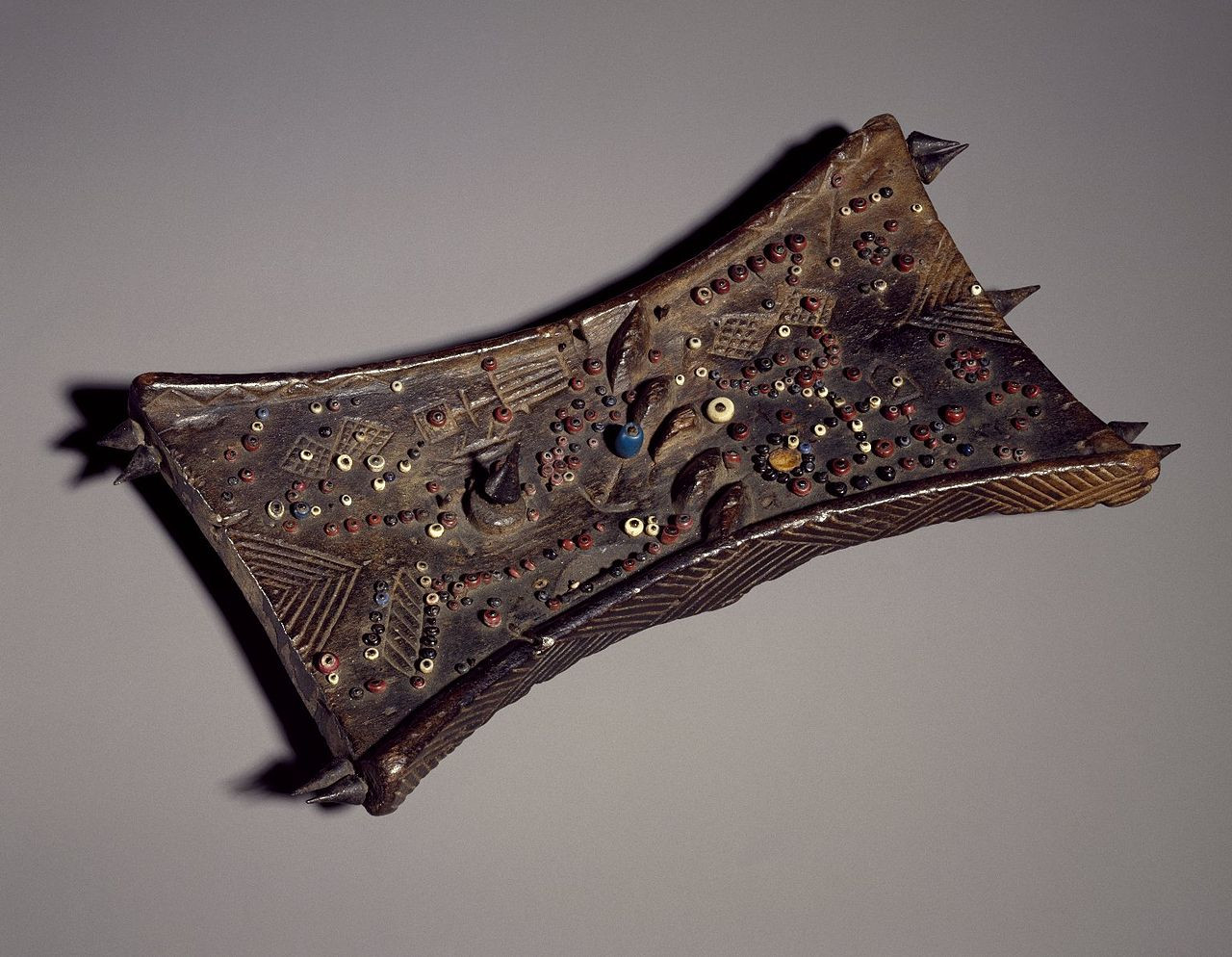 Lukasa ("the long hand") is a memory device that was created, manipulated and protected by the Bambudye, a once powerful secret society of Luba people (Zaire, now — the Democratic Republic of Congo). Lukasa memory boards are covered with multicolored beads, shells and bits of metal (or are incised or embossed with carved symbols) the colors and configurations of which stimulate the recollection of important people, places, things, relationships and events perfomed by men of memory. Photo: Brooklyn Museum