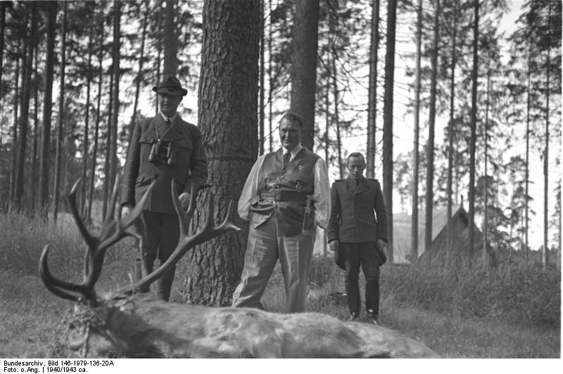 East Prussia, Rominten. Reichsjägerhof, Friedrich Fromm with binoculars and Hermann Göring standing in front of a killed deer. September 1941. Photo: Robert Kropp. Source: Bild 146-1979-136-20A, Das Bundesarchiv, Germany.