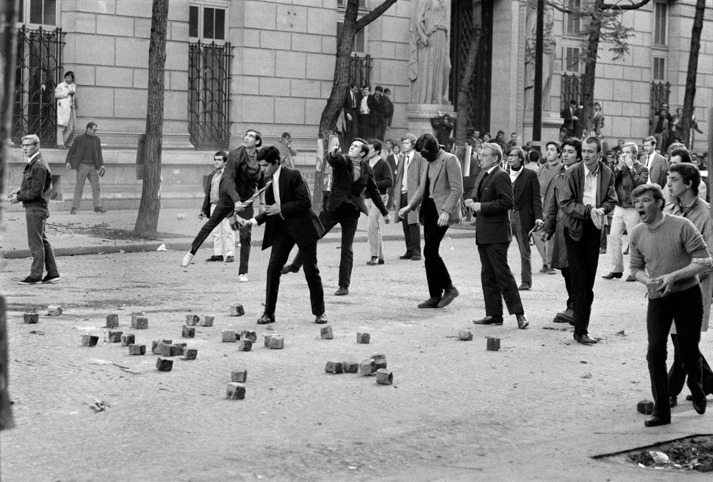 Bruno Barbey. Demonstrators with rocks in front of the Medecine University boulevard Saint Germain. 1968