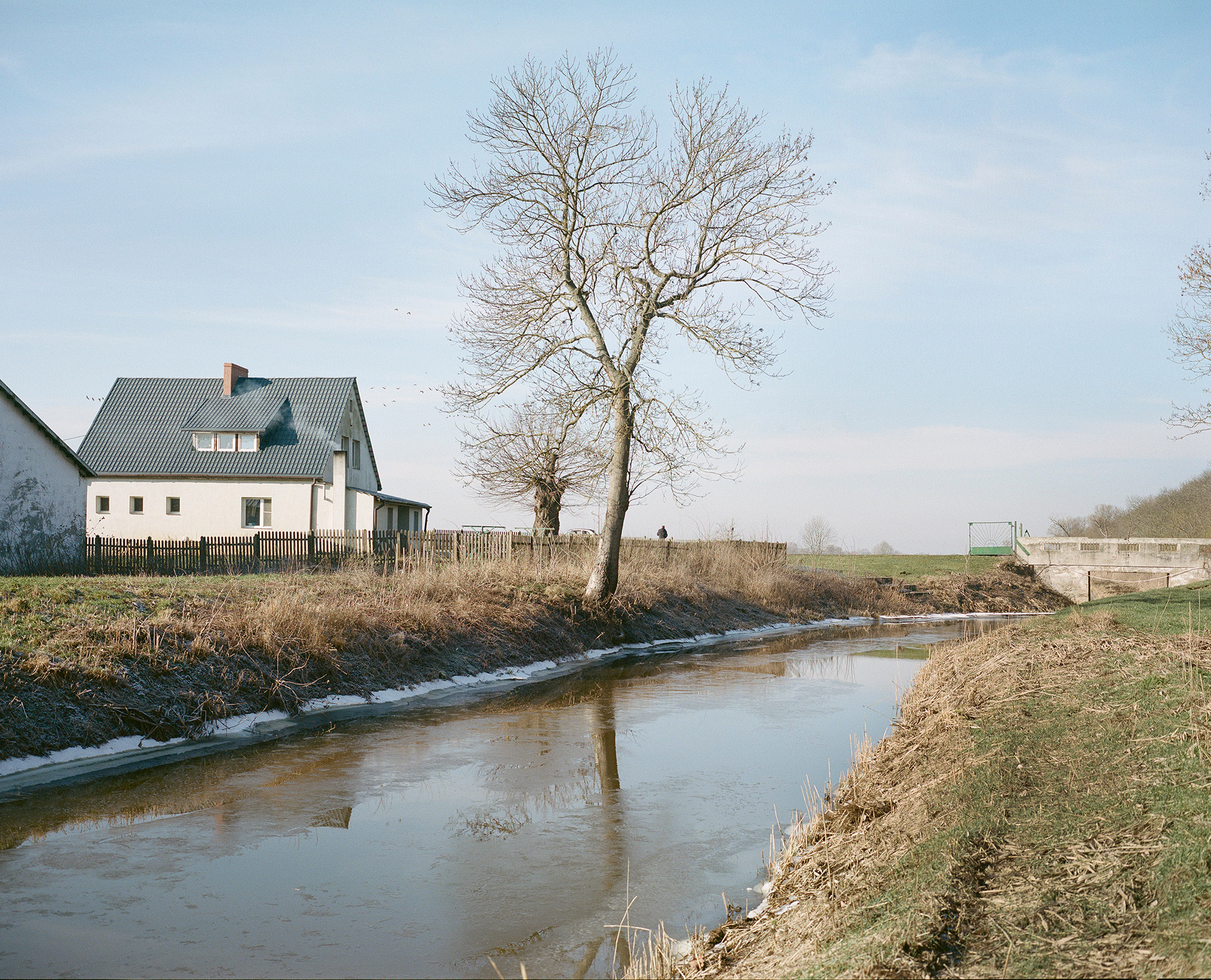 The farmstead of Żabczyn, Poland, formerly Neu-Amerika (‘New America’), stands on reclaimed land next to an artificial canal built as part of the Friderician colonization in the late 18th century