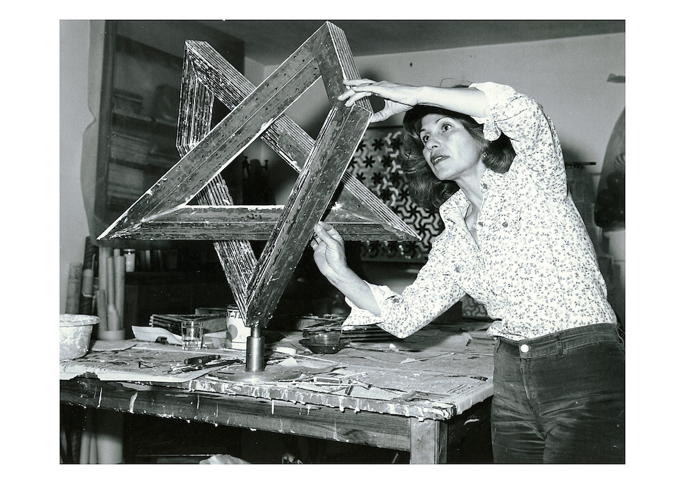 Monir Shahroudy Farmanfarmaian in her studio working on Heptagon Star, Tehran, 1975. Courtesy of the artist and The Third Line, Dubai