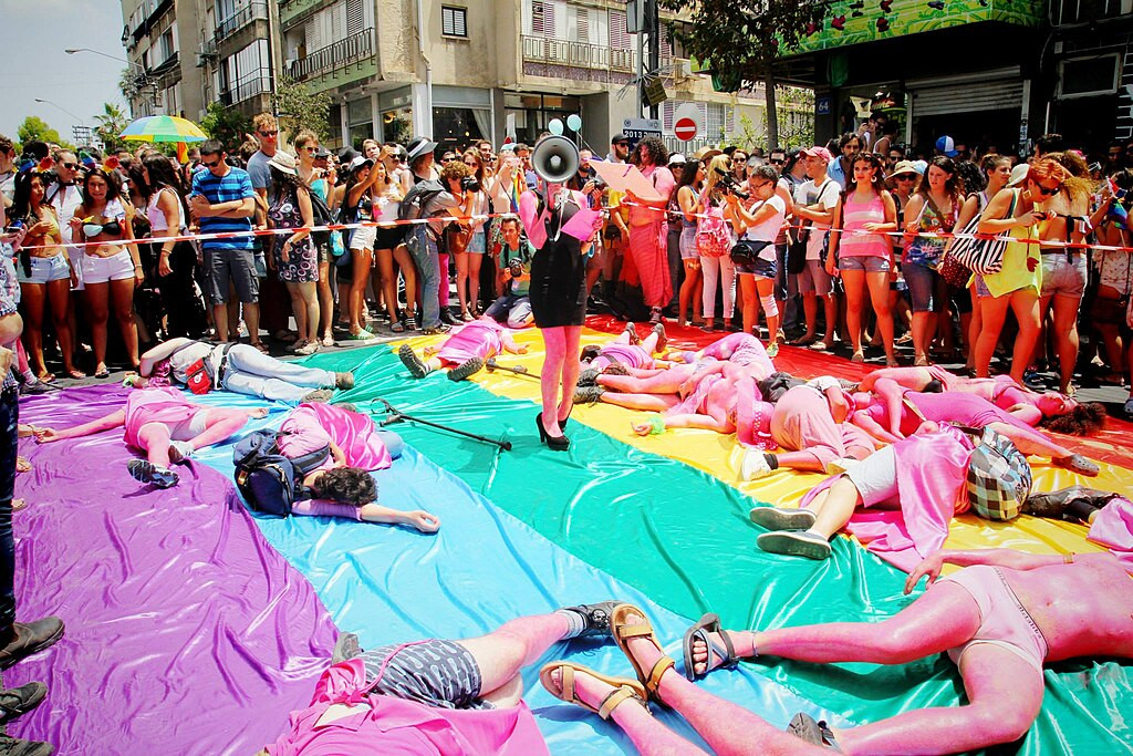 During the 2013 Tel Aviv Pride Parade, the anarcho-queer collective "Mashpritzot" held a die-in to protest Israeli pinkwashing, and the homonormative priorities of the city-sposored LGBT center.